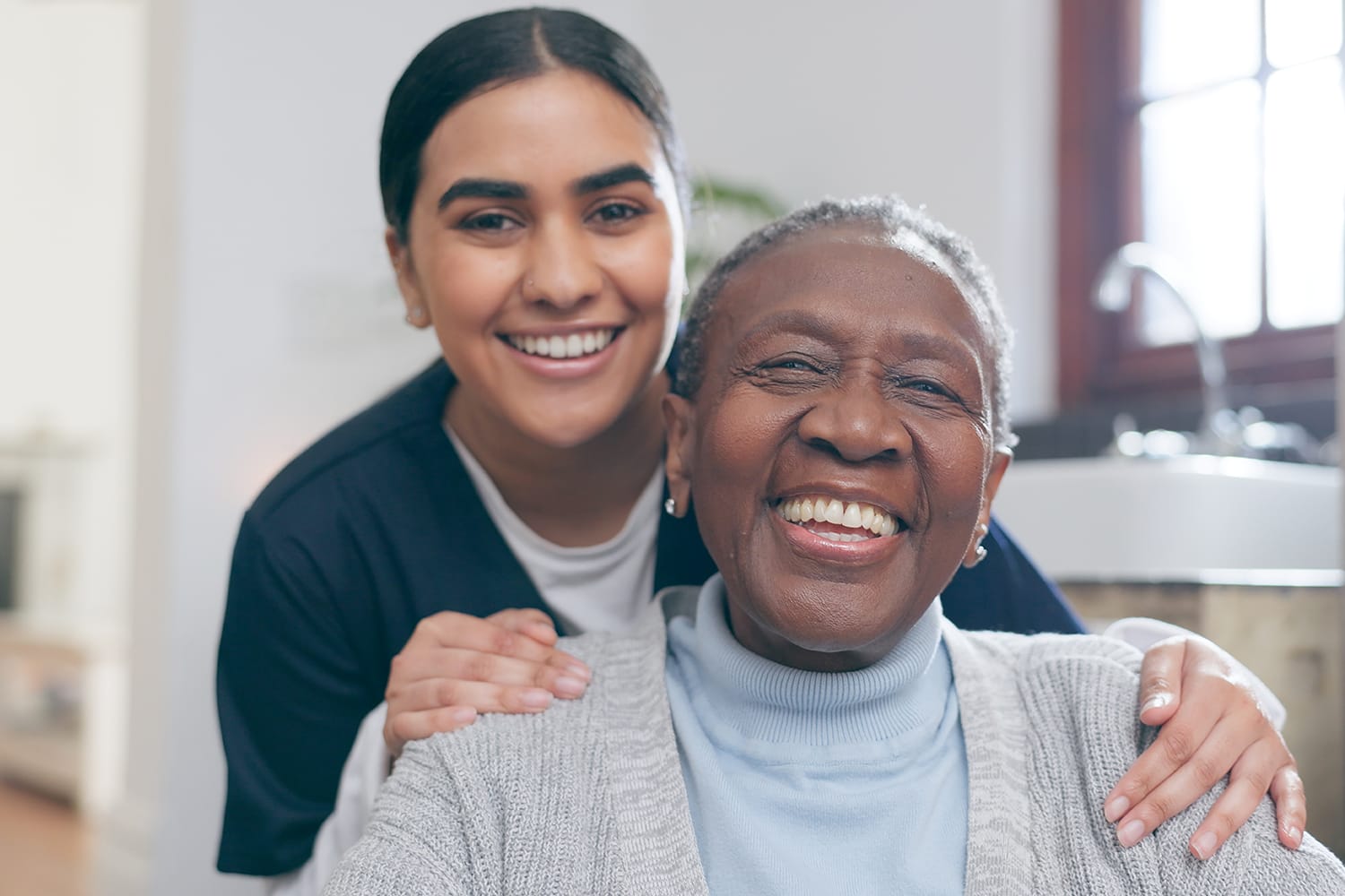 image of a smiling cna woman helping an elderly patient